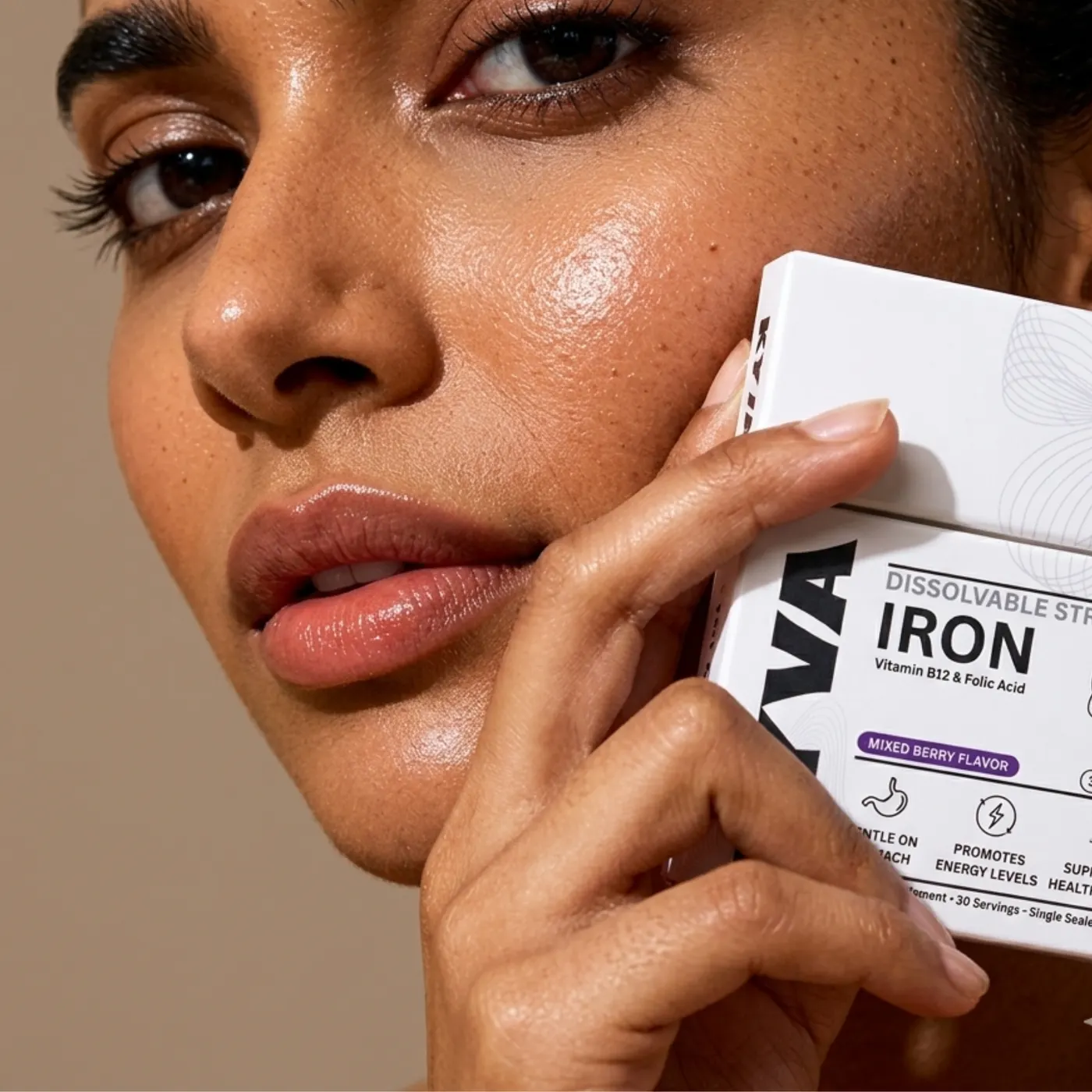 Woman holding a KYVA dissolvable strip